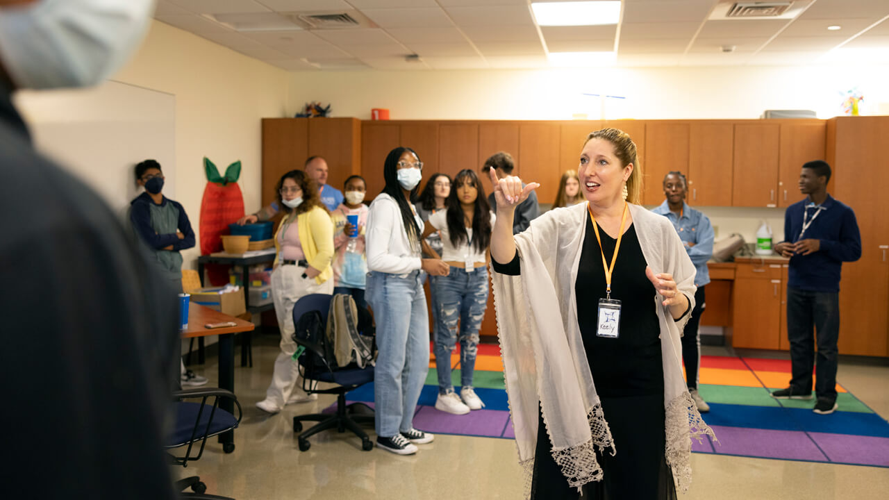 QUADS students receive direction from their instructor in the North Haven campus School of Education .