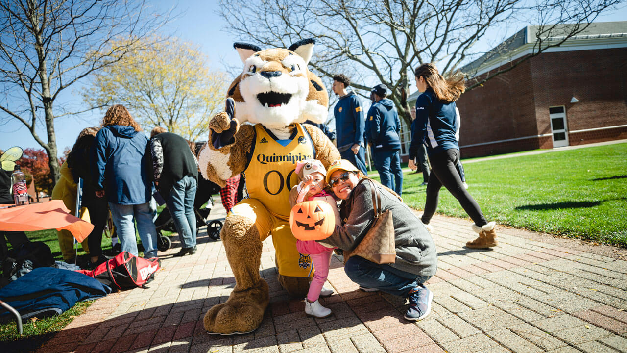 Boomer pointing at camera and taking a photo with family