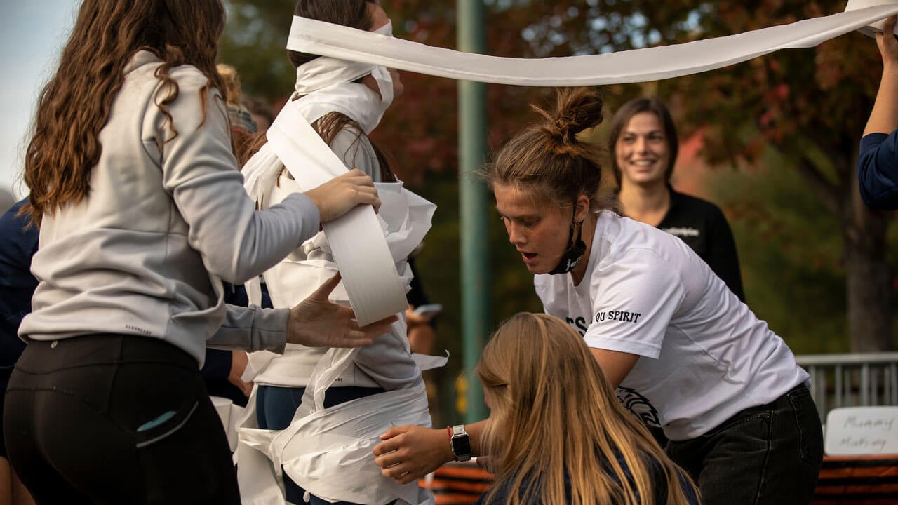 Quinnipiac students play a mummy game