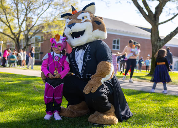 Boomer poses with a person in a costume